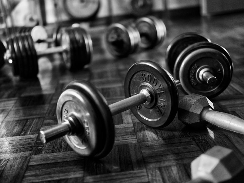 A set of dumbbells on a clean gym floor.